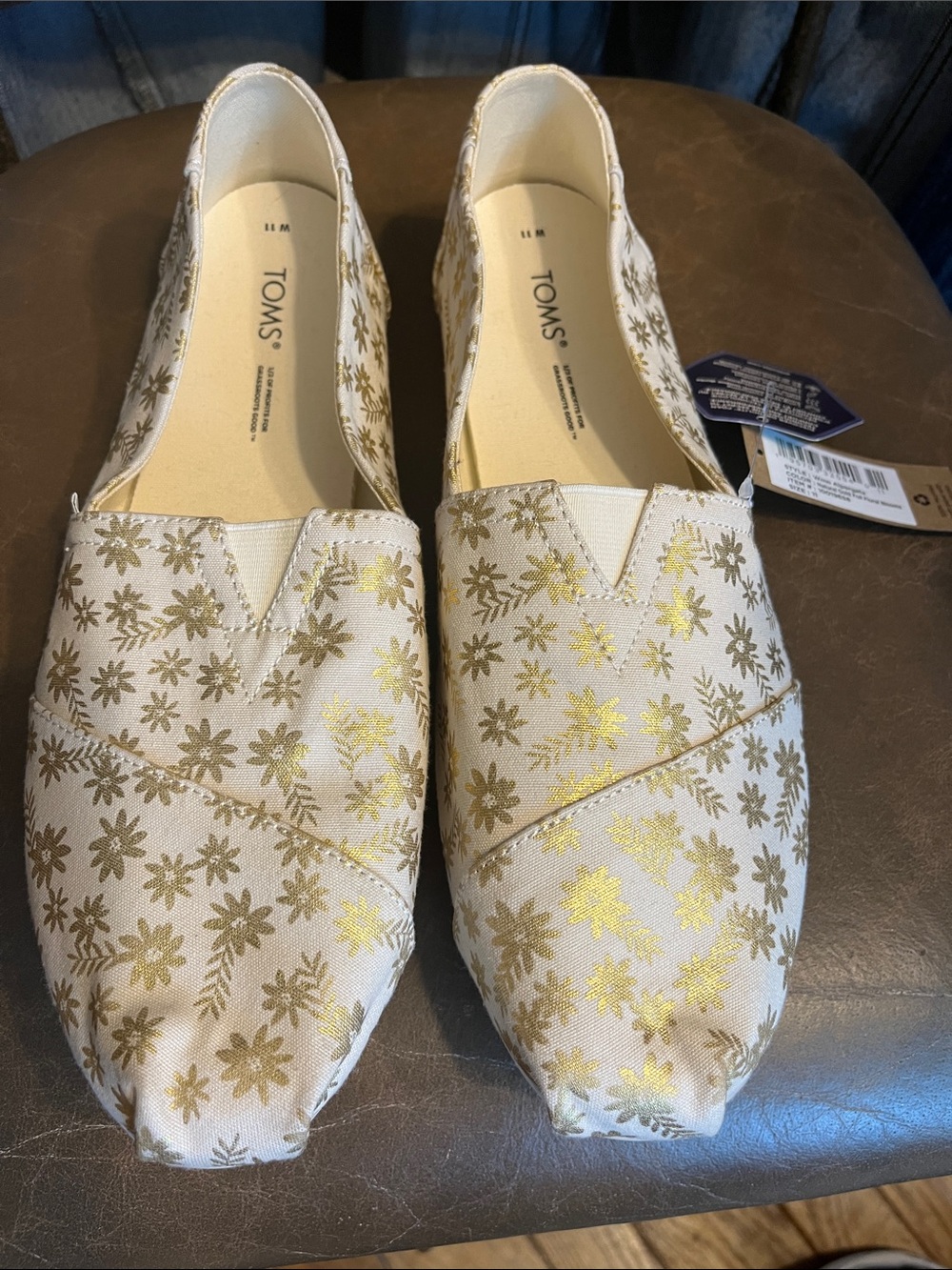 TOMS Cream Slip-On Flats with Gold Floral Accent